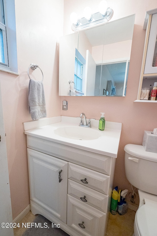 bathroom with vanity and toilet