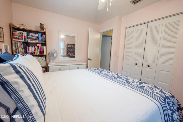 bedroom with ceiling fan and a closet