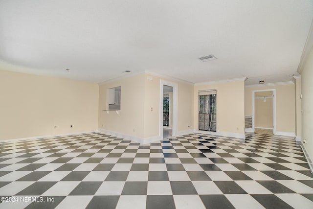 spare room featuring ornamental molding