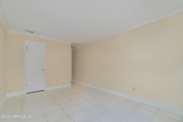 empty room featuring crown molding