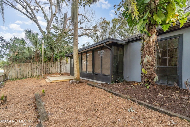 view of yard with a sunroom