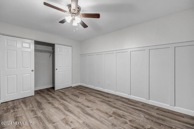 unfurnished bedroom featuring ceiling fan and light hardwood / wood-style flooring