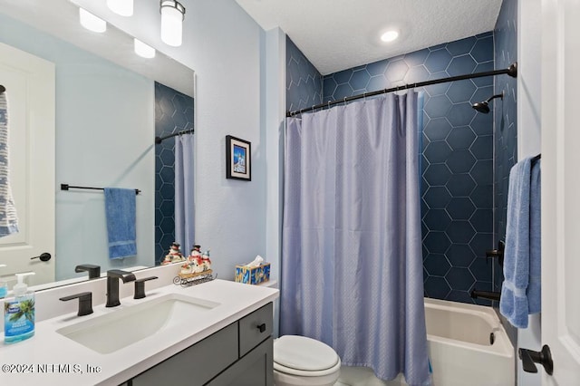 full bathroom featuring a textured ceiling, vanity, shower / tub combo, and toilet