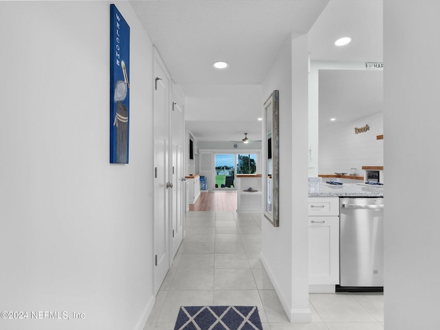 corridor with light tile patterned floors