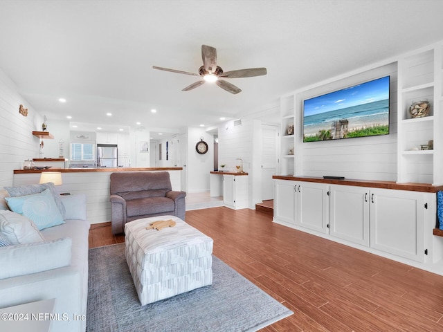 8550 A1A S Unit 13131, Saint Augustine, FL 32080 - living room featuring ceiling fan, wood finished floors, wooden walls, recessed lighting, and built in features