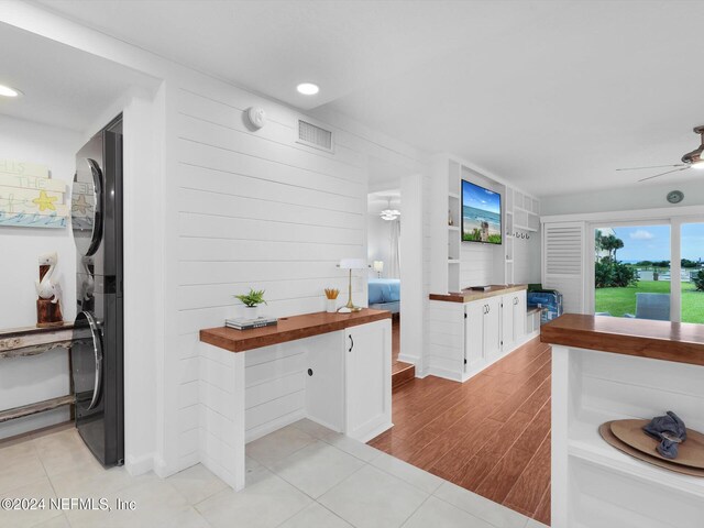 8550 A1A S Unit 13131, Saint Augustine, FL 32080 - kitchen with white cabinetry, butcher block countertops, freestanding refrigerator, ceiling fan, and light wood-type flooring