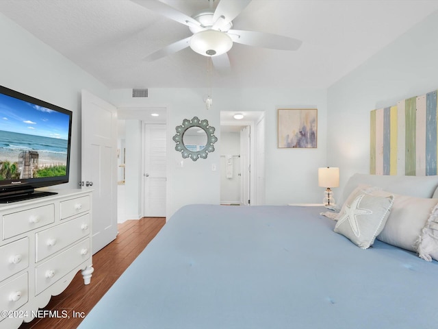8550 A1A S Unit 13131, Saint Augustine, FL 32080 - bedroom with dark wood-style floors, a ceiling fan, and baseboards