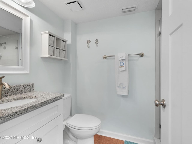 8550 A1A S Unit 13131, Saint Augustine, FL 32080 - bathroom with vanity, wood finished floors, toilet, a shower, and baseboards