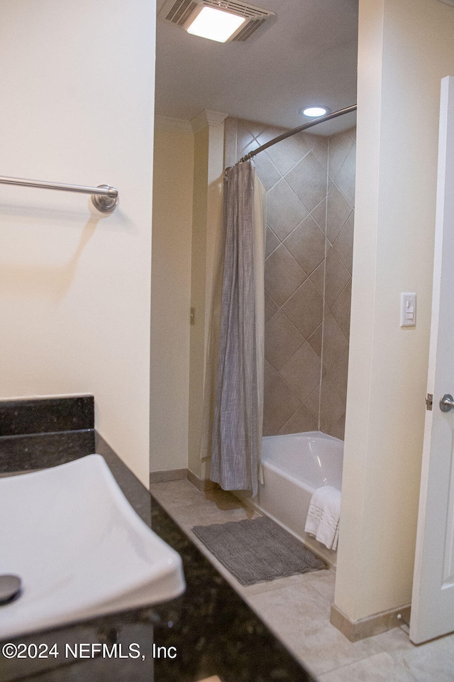 bathroom with tile patterned flooring and shower / bathtub combination with curtain