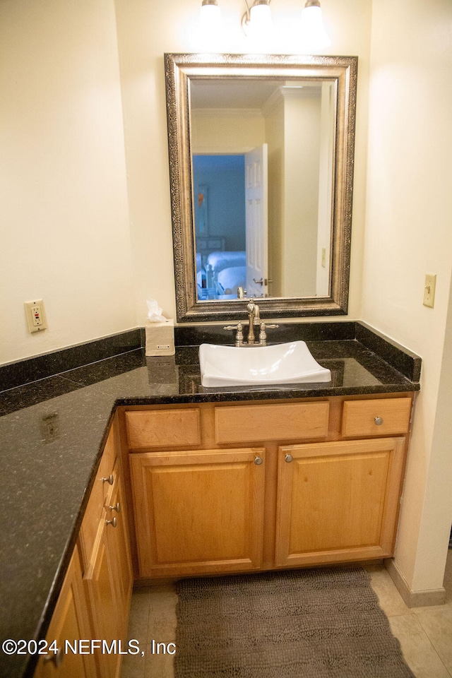 bathroom featuring tile patterned floors and vanity