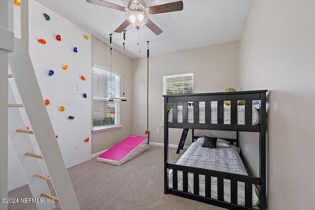 bedroom with ceiling fan and carpet floors