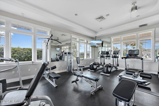 workout area with ceiling fan and a healthy amount of sunlight