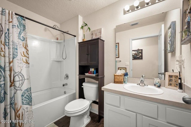 full bathroom featuring vanity, toilet, a textured ceiling, wood-type flooring, and shower / tub combo