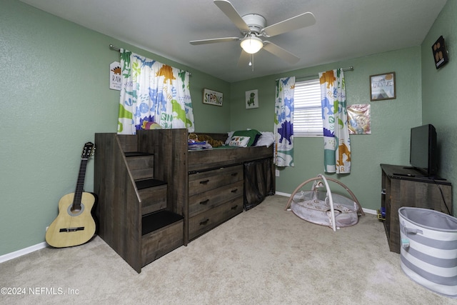 bedroom with light carpet and ceiling fan