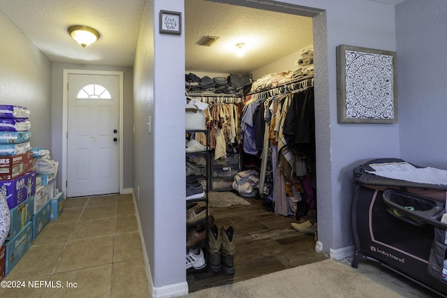 spacious closet featuring tile patterned floors