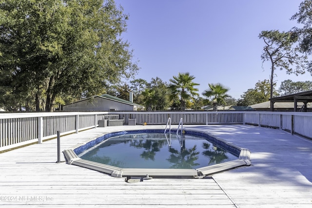 view of pool featuring a deck