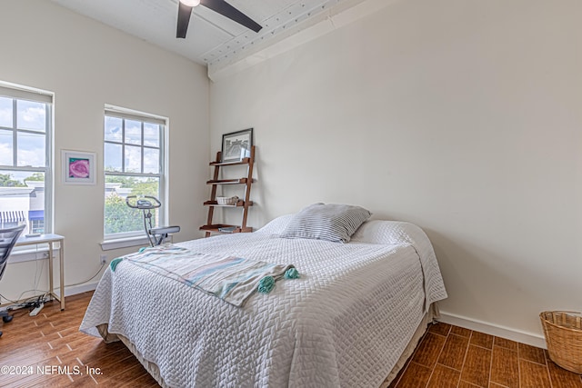 bedroom with wood-type flooring and ceiling fan