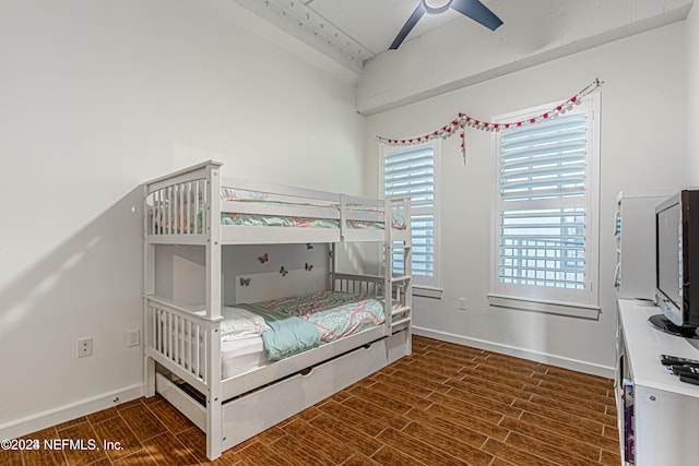 bedroom featuring ceiling fan and dark wood-type flooring