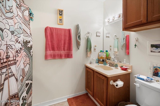 bathroom with vanity and toilet