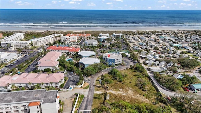 aerial view featuring a view of the beach and a water view