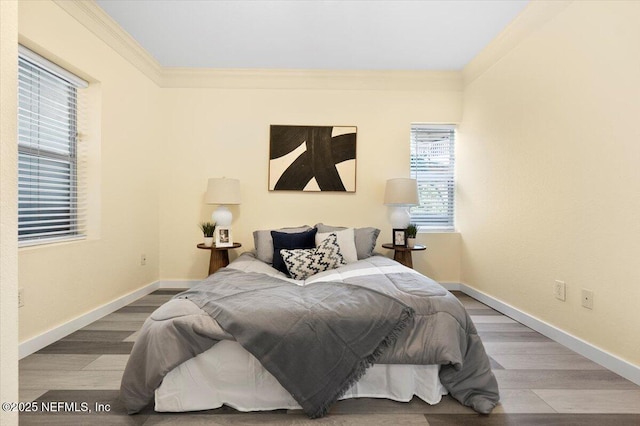 bedroom featuring hardwood / wood-style flooring and ornamental molding