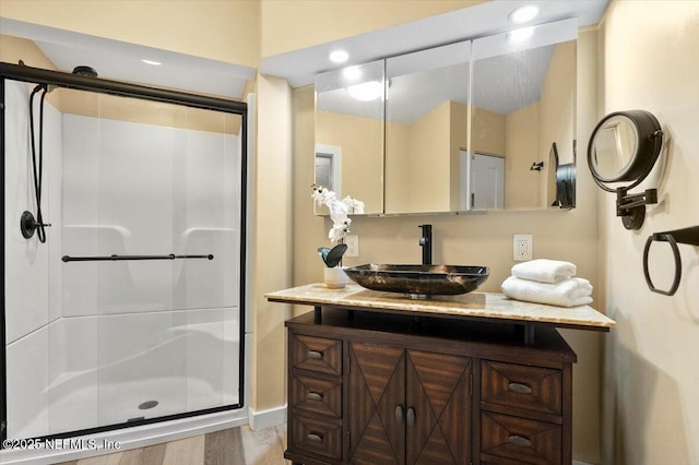 bathroom with vanity and an enclosed shower