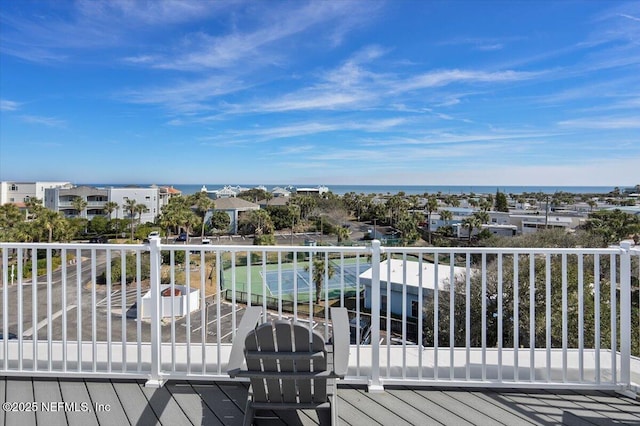 wooden deck with a water view