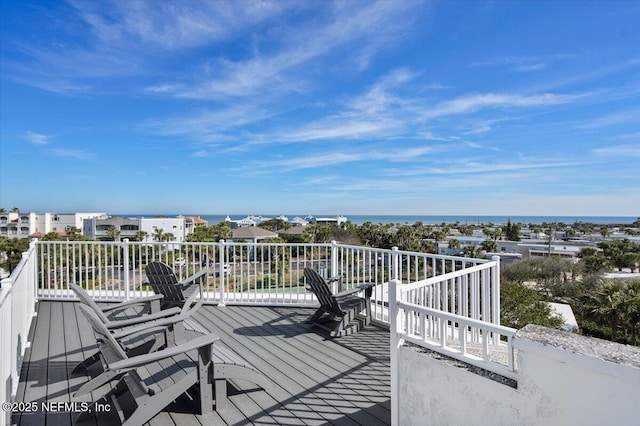 wooden deck with a water view