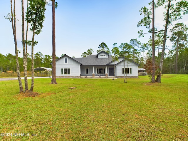 single story home with a front lawn and a carport