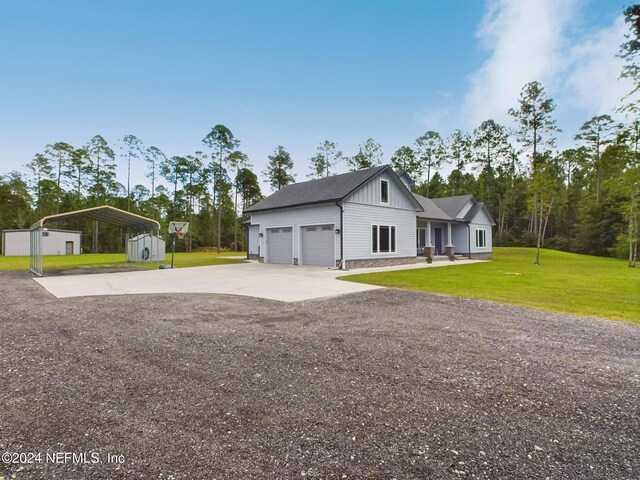 view of property exterior with a storage unit, a carport, and a lawn