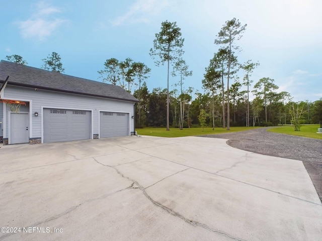 garage with a yard