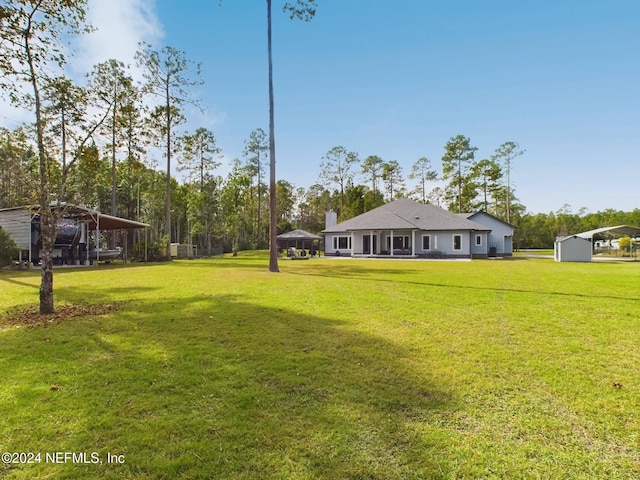 view of yard with a carport