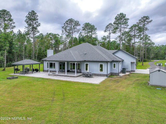 back of house featuring a gazebo, a yard, a patio, and central AC unit