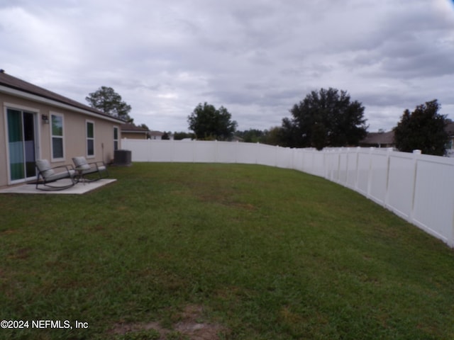 view of yard featuring central AC unit