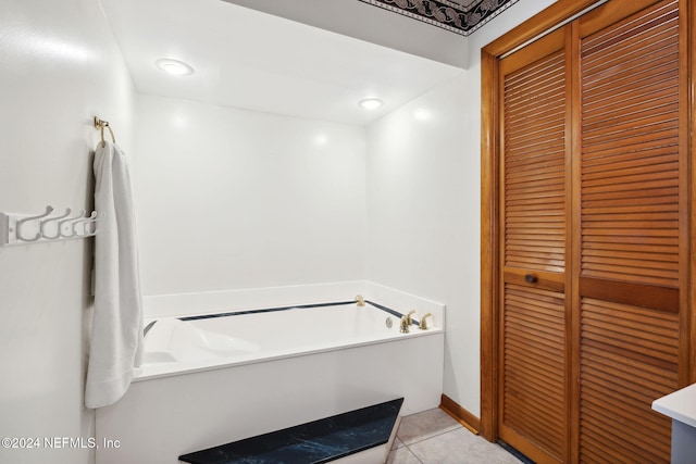 bathroom featuring tile patterned floors and a tub