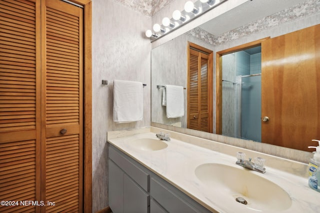 bathroom with vanity and an enclosed shower