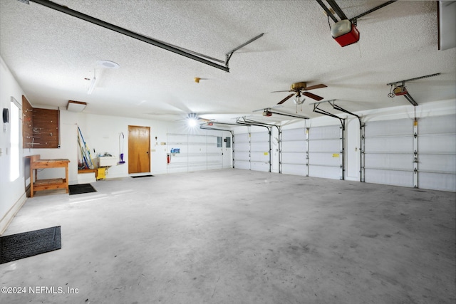 garage featuring ceiling fan and a garage door opener