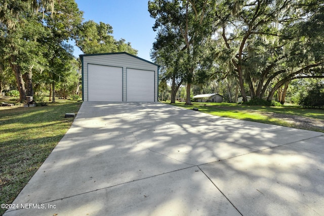 garage featuring a yard