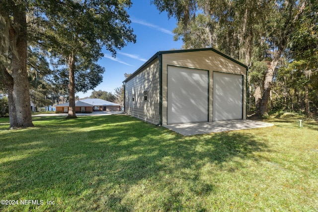 exterior space featuring a yard and a garage