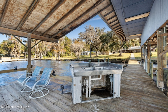 dock area with sink and a water view