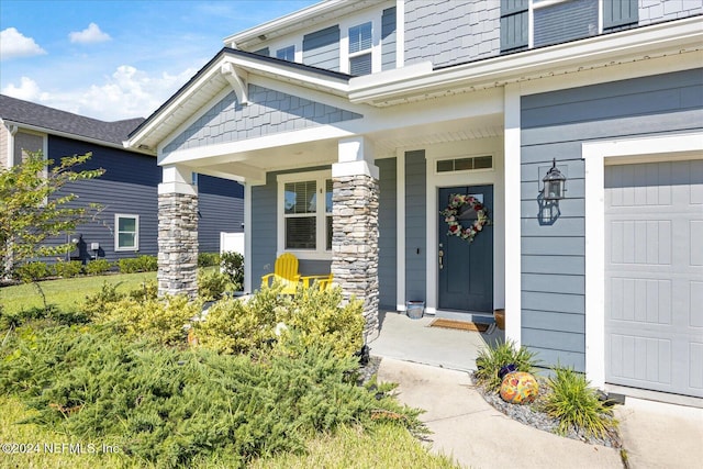 property entrance with covered porch