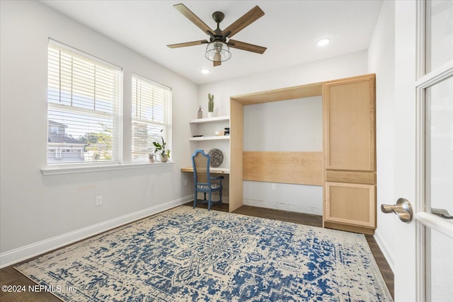 office with ceiling fan and dark wood-type flooring