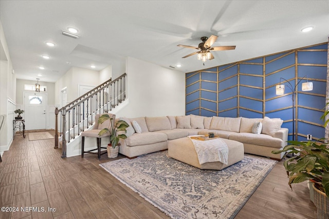 living room with ceiling fan and hardwood / wood-style flooring