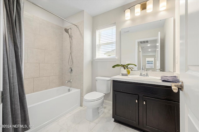 full bathroom featuring shower / bath combination with curtain, toilet, and vanity