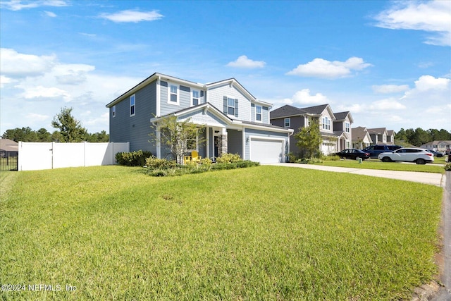 view of front of home featuring a front yard and a garage