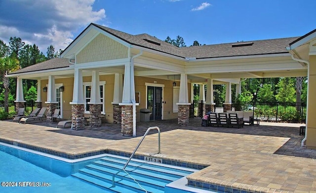 view of pool with outdoor lounge area and a patio