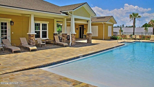 view of swimming pool featuring a patio area