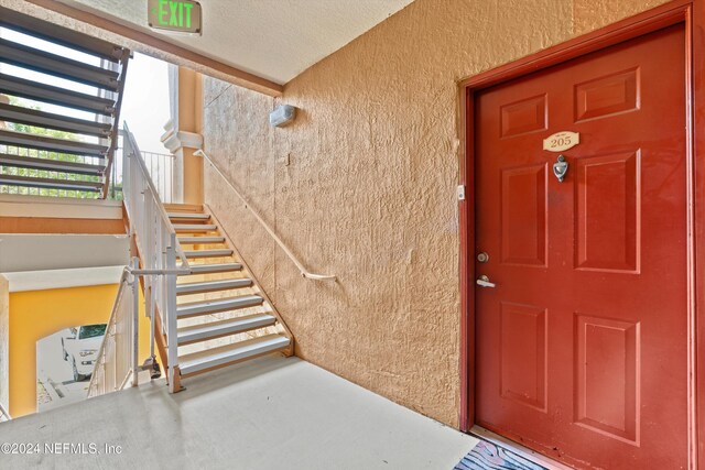 605 Fairway Dr Unit 205, Saint Augustine, FL 32084 - doorway to property featuring stucco siding