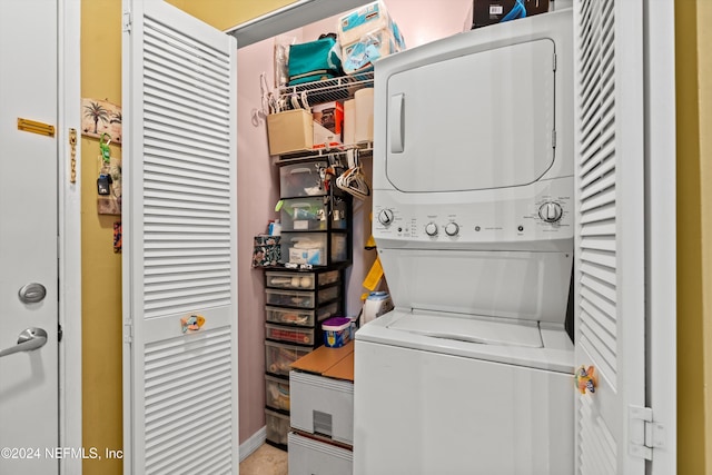 laundry area with stacked washing maching and dryer