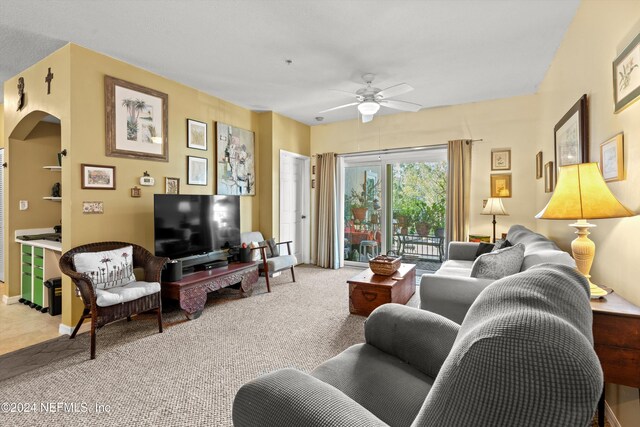 605 Fairway Dr Unit 205, Saint Augustine, FL 32084 - living area featuring a ceiling fan, carpet, and arched walkways